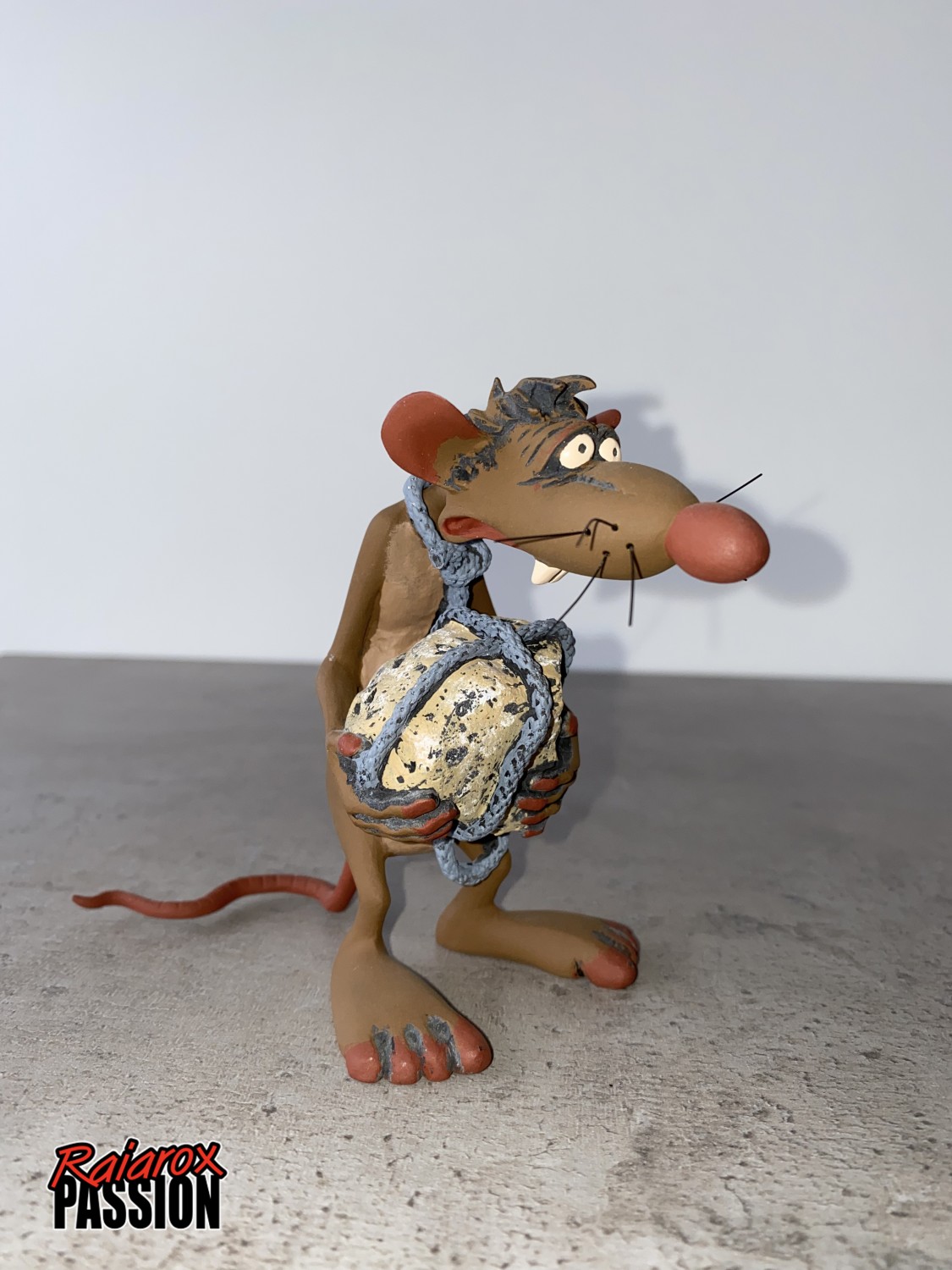 Le rat avec sa pierre